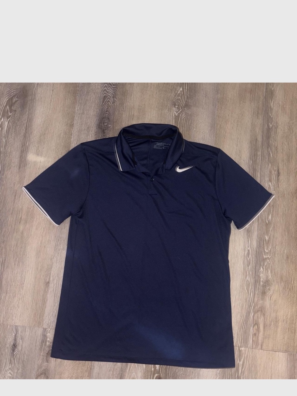 Nike Men’s Navy Polo with White Swoosh